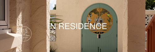 Arched walkway and decorative sage green gate at The Shores Miami, part of TH Brown’s In Residence design series.