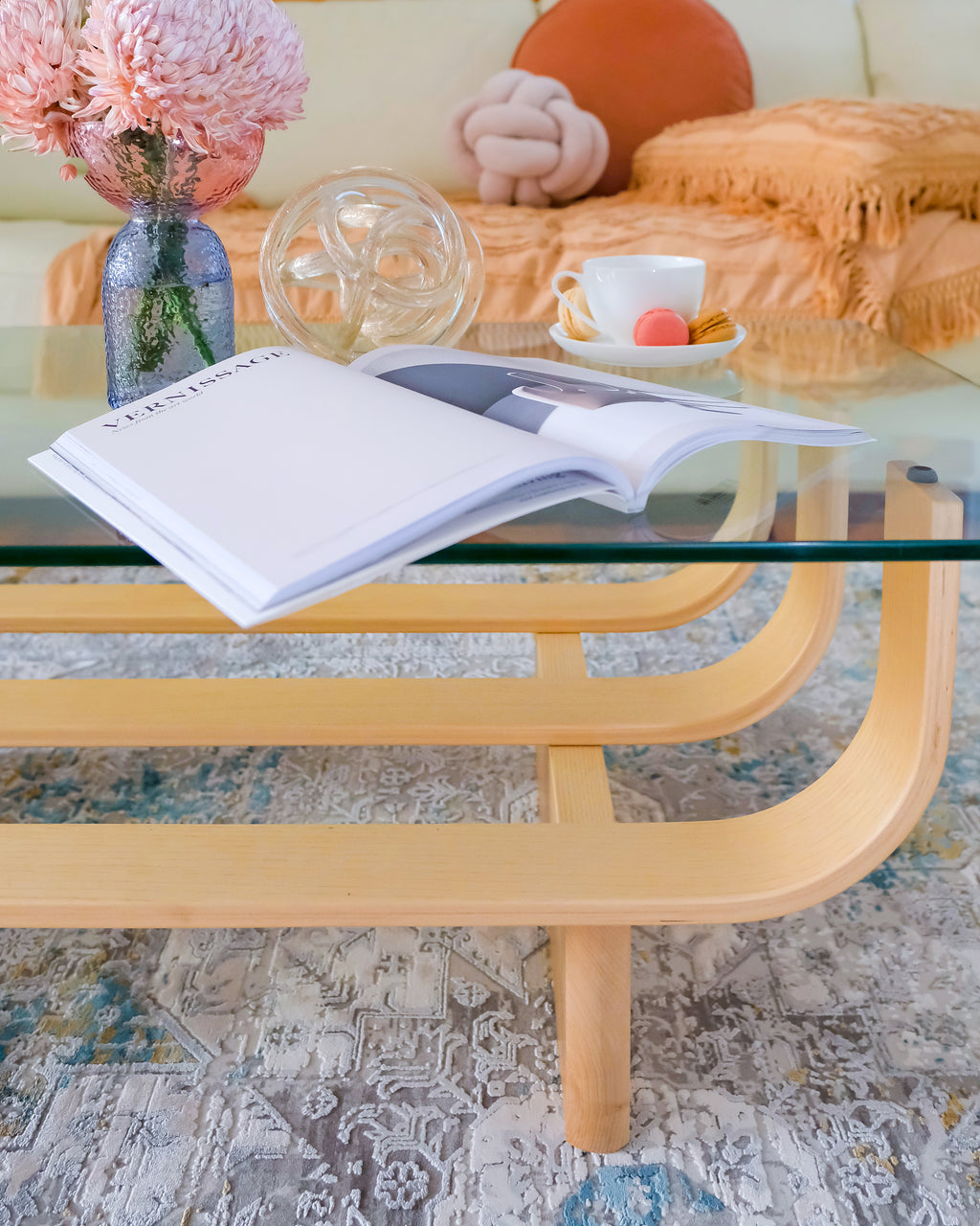 TH Brown Aquarius Coffee Table in Clear Ash, styled with books, flowers and coffee for a warm, relaxed and creative Australian living space.