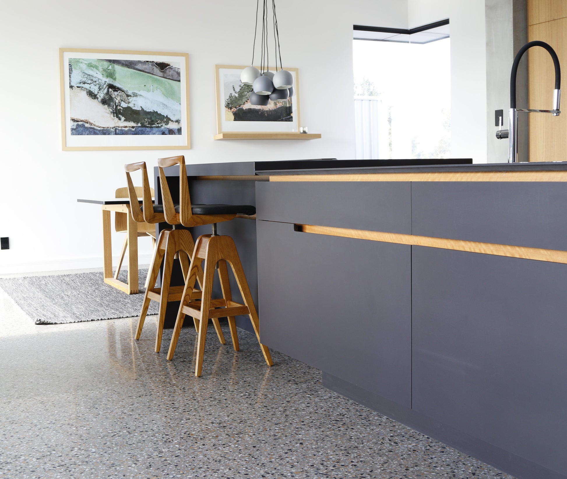 TH Brown Danish Bar Stools in timber with black upholstery at a contemporary kitchen island, handcrafted Australian furniture made in Adelaide