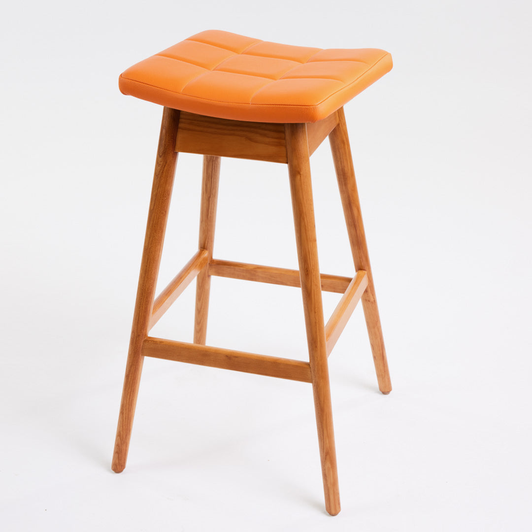 TH Brown Martelle Bar Stool in Calypso Orange with Teak Ash frame, blending vibrant colour and warm timber for playful modern Australian living.