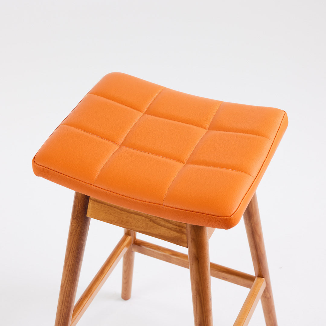 TH Brown Martelle Bar Stool in Calypso Orange with Teak Ash frame, blending vibrant colour and warm timber for playful modern Australian living.