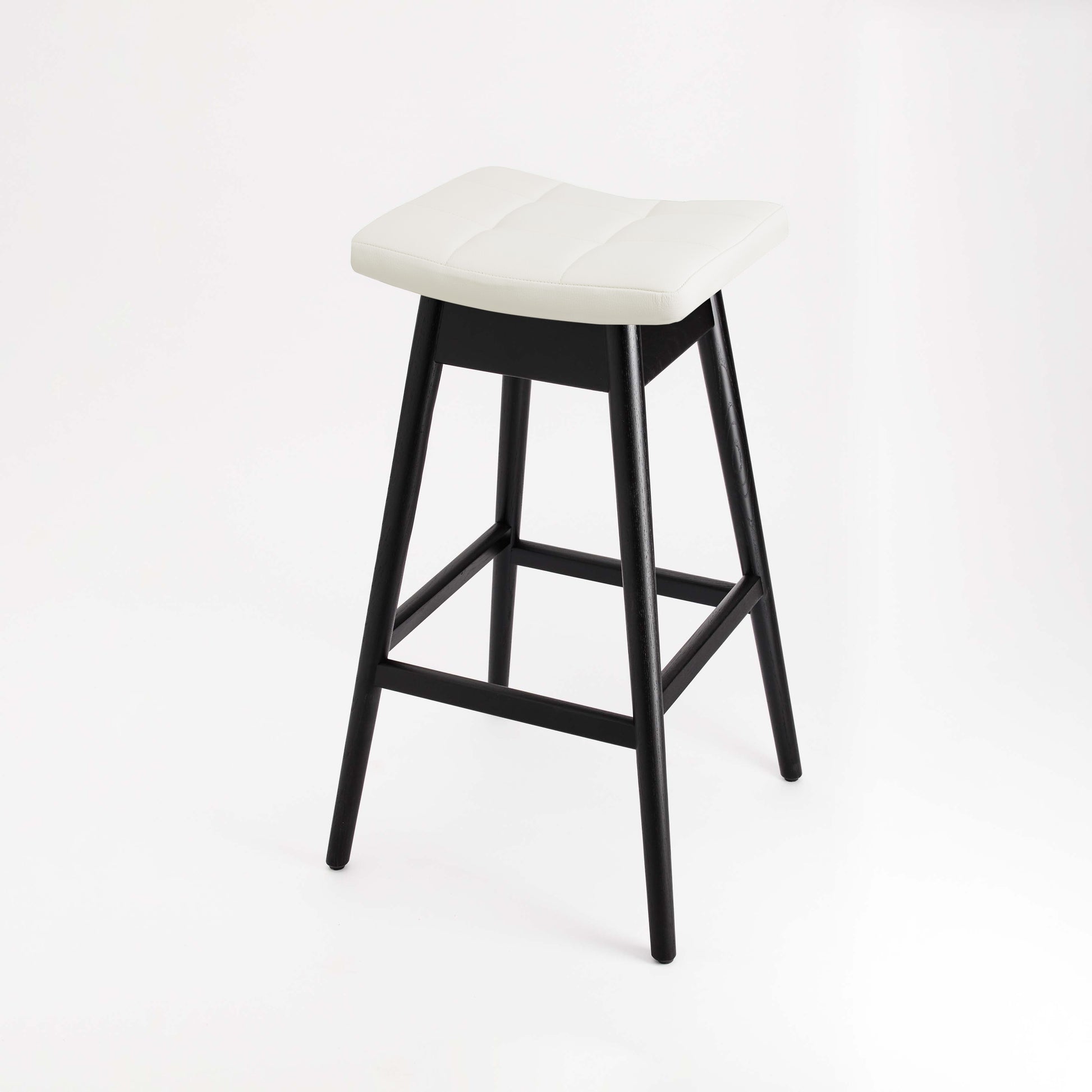 TH Brown Martelle Bar Stool in Arctic White with Matt Black frame, blending crisp contrast and sculptural form for stylish modern Australian living.
