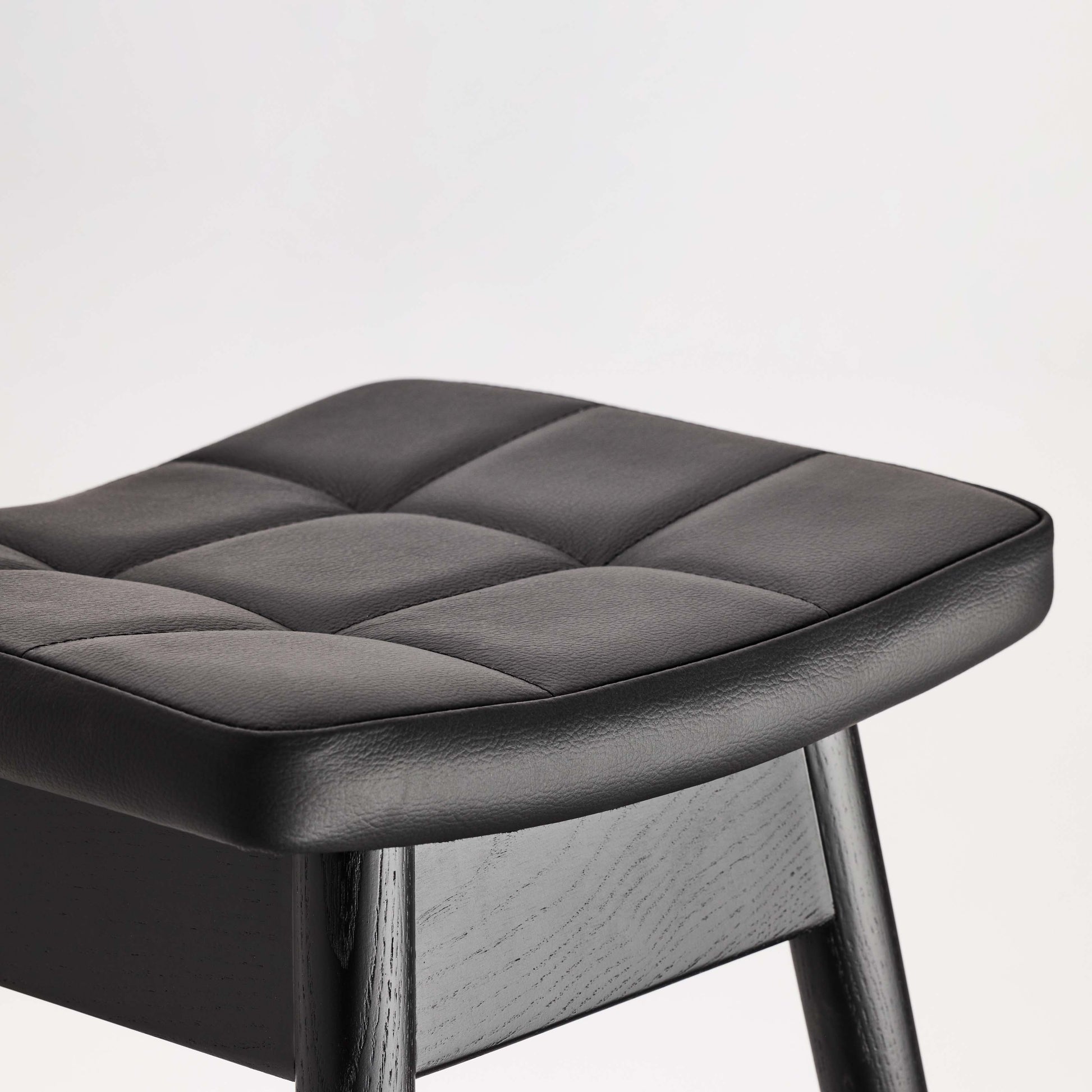 TH Brown Martelle Bar Stool in Black with Matt Black frame, creating a sleek monochrome statement for sophisticated modern Australian living.