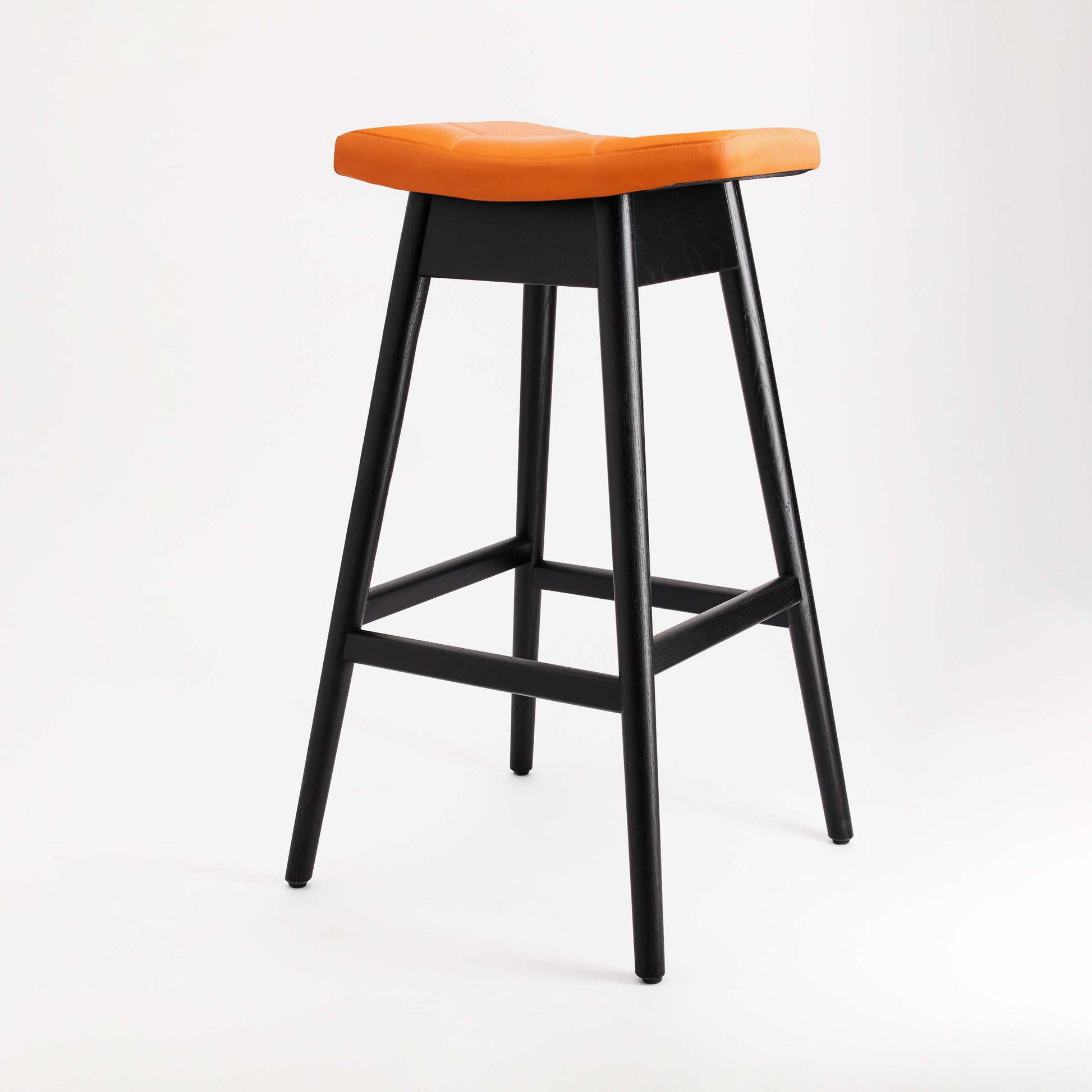 TH Brown Martelle Bar Stool in Calypso Orange with Matt Black frame, bringing vibrant color and bold contrast to modern Australian living.