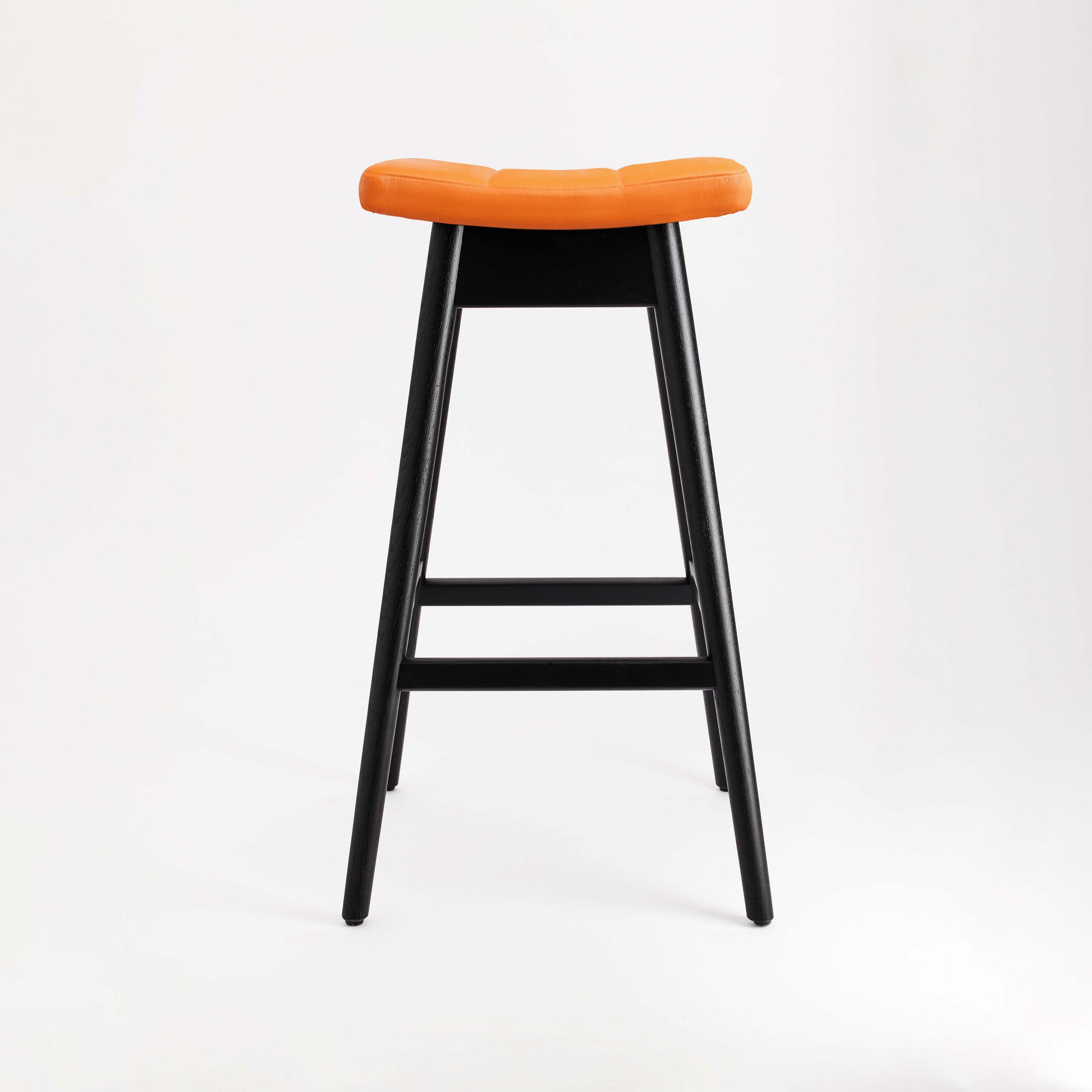 TH Brown Martelle Bar Stool in Calypso Orange with Matt Black frame, bringing vibrant colour and bold contrast to modern Australian living.