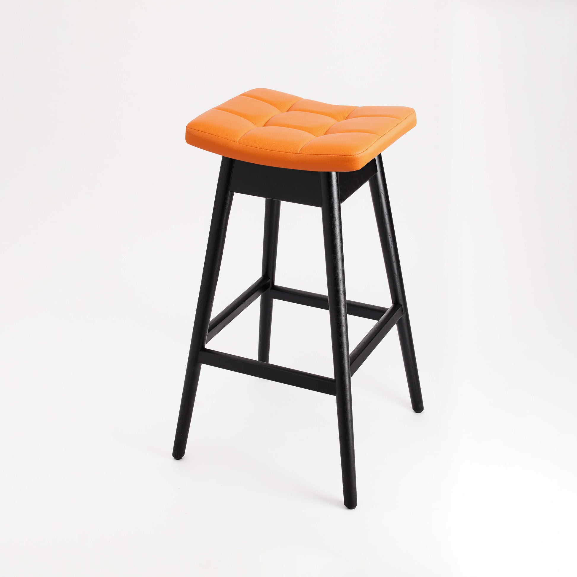 TH Brown Martelle Bar Stool in Calypso Orange with Matt Black frame, bringing vibrant color and bold contrast to modern Australian living.