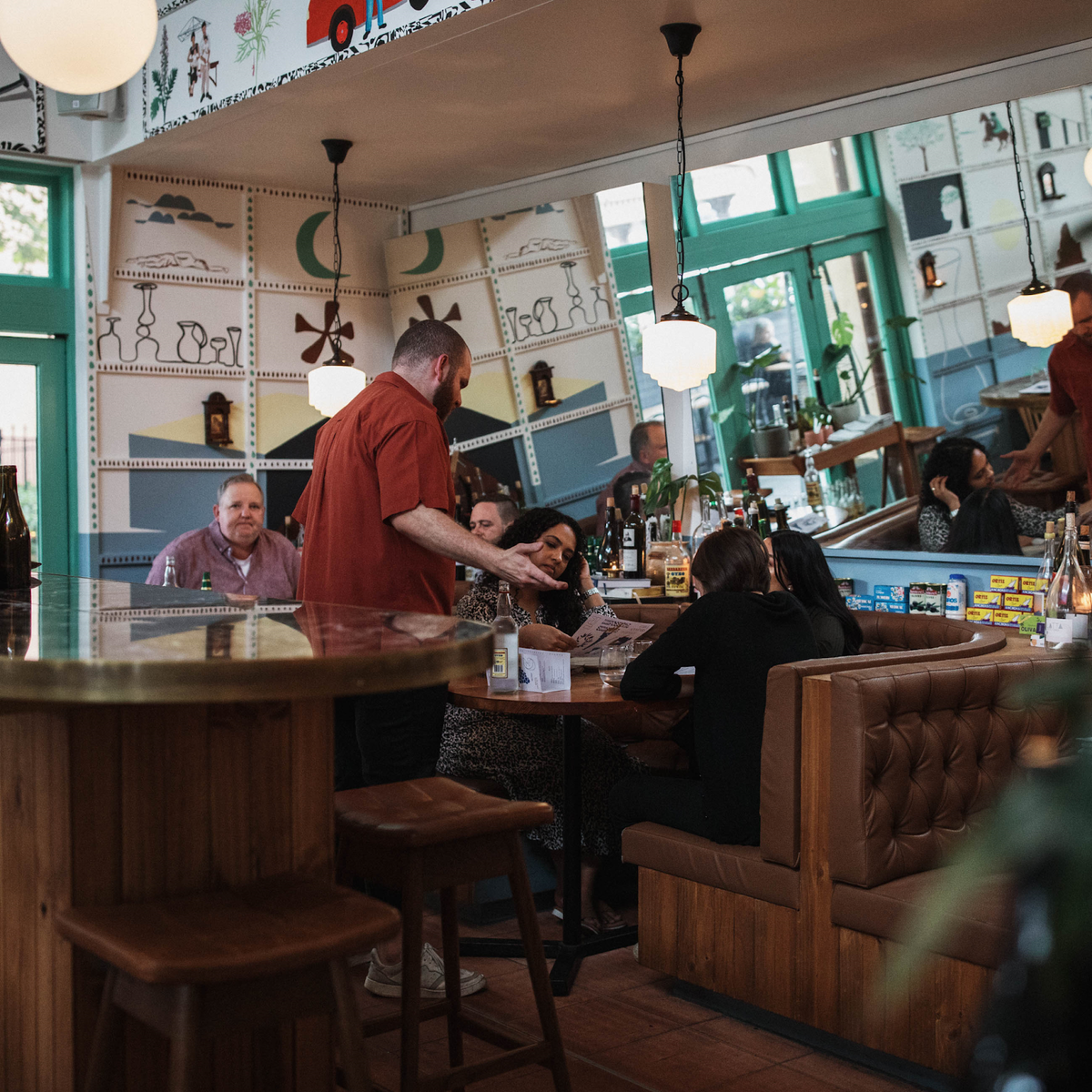 TH Brown Martelle Bar Stools in a restaurant interior, iconic Australian mid-century modern furniture handcrafted in Adelaide