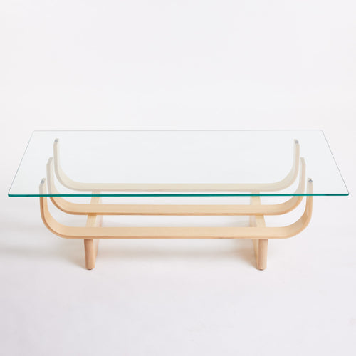 TH Brown Aquarius Coffee Table in Clear Ash with clear glass, blending natural timber warmth and sculptural form for timeless modern Australian living.