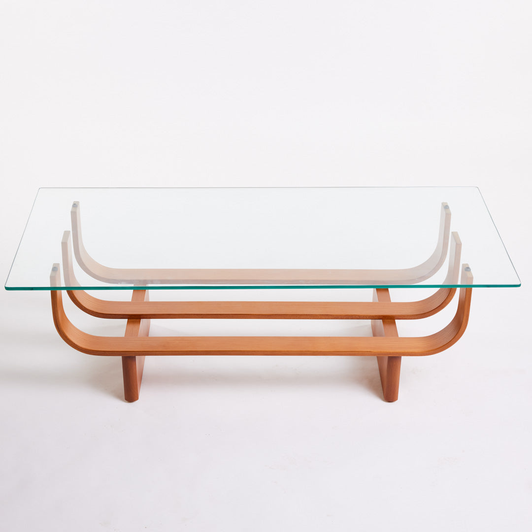 TH Brown Aquarius Coffee Table in Teak Ash with clear glass, blending natural timber warmth and sculptural form for timeless modern Australian living.