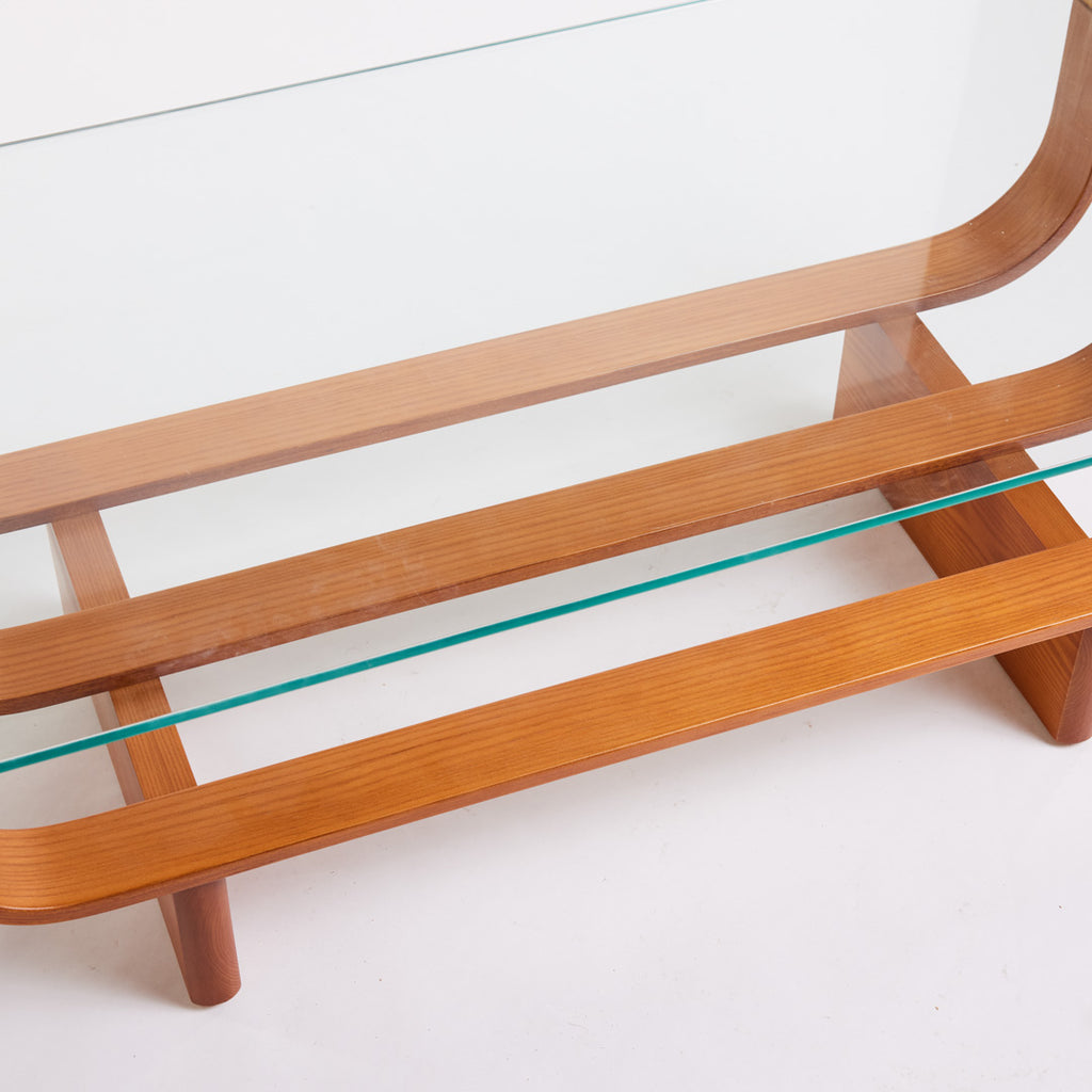 TH Brown Aquarius Coffee Table in Teak Ash with clear glass, blending natural timber warmth and sculptural form for timeless modern Australian living.