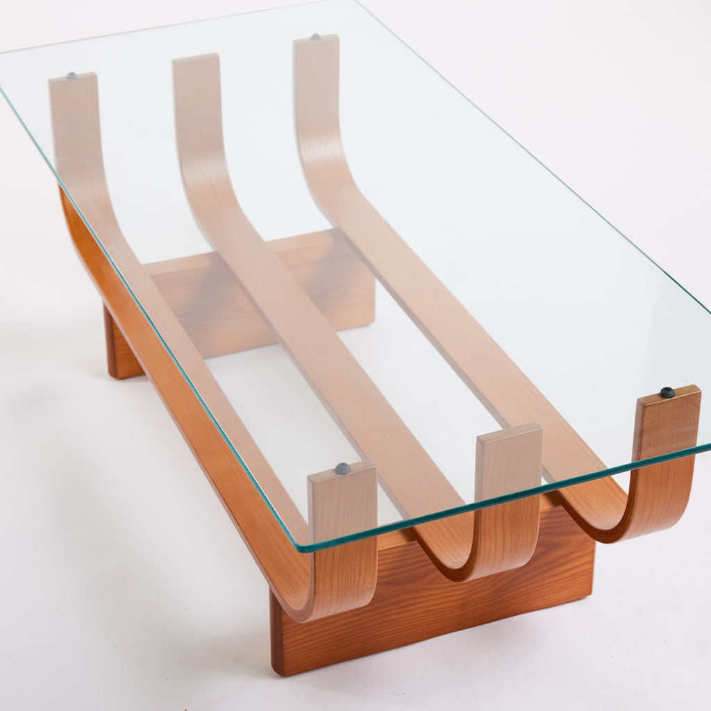 TH Brown Aquarius Coffee Table in Teak Ash with clear glass, blending natural timber warmth and sculptural form for timeless modern Australian living.