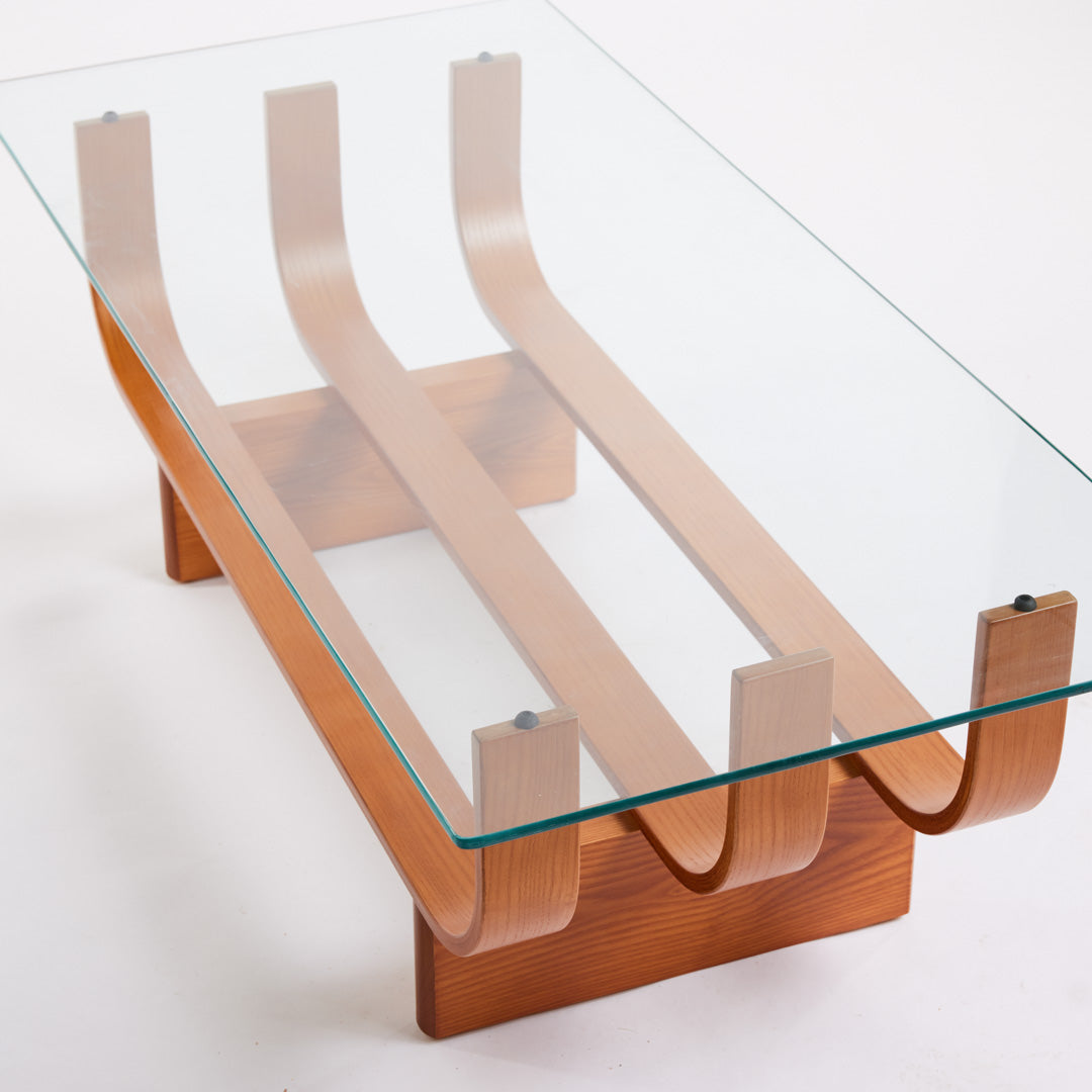 TH Brown Aquarius Coffee Table in Teak Ash with clear glass, blending natural timber warmth and sculptural form for timeless modern Australian living.