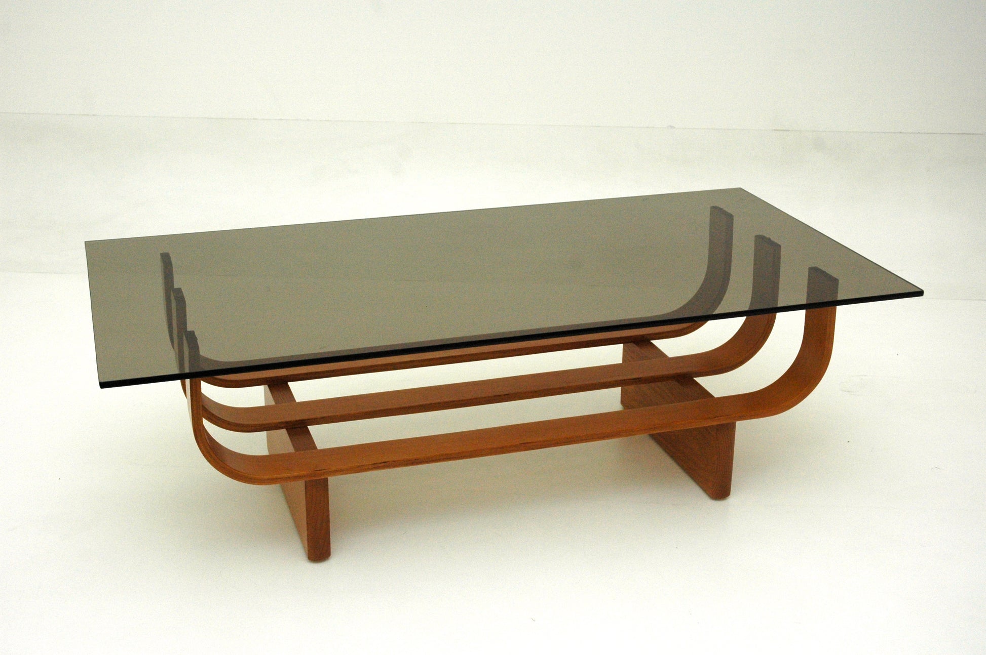 TH Brown Aquarius Coffee Table in Teak Ash with Grey glass, blending natural timber warmth and sculptural form for timeless modern Australian living.