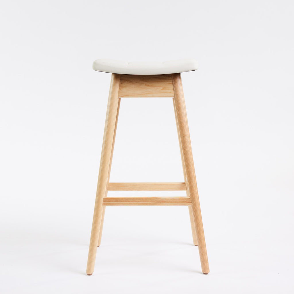TH Brown Martelle Bar Stool in Arctic White with Clear Ash frame, blending crisp upholstery and natural timber for fresh modern Australian living.