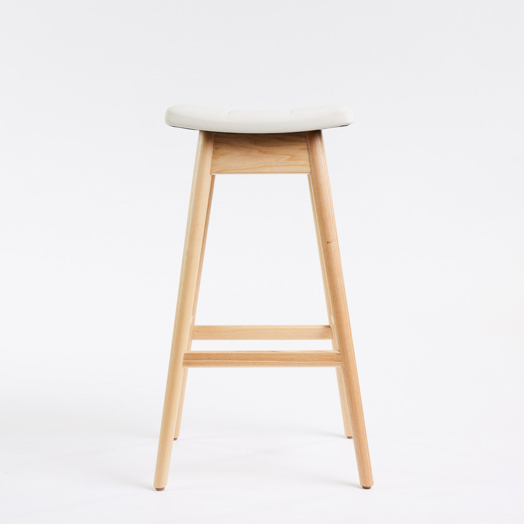 TH Brown Martelle Bar Stool in Arctic White with Clear Ash frame, blending crisp upholstery and natural timber for fresh modern Australian living.