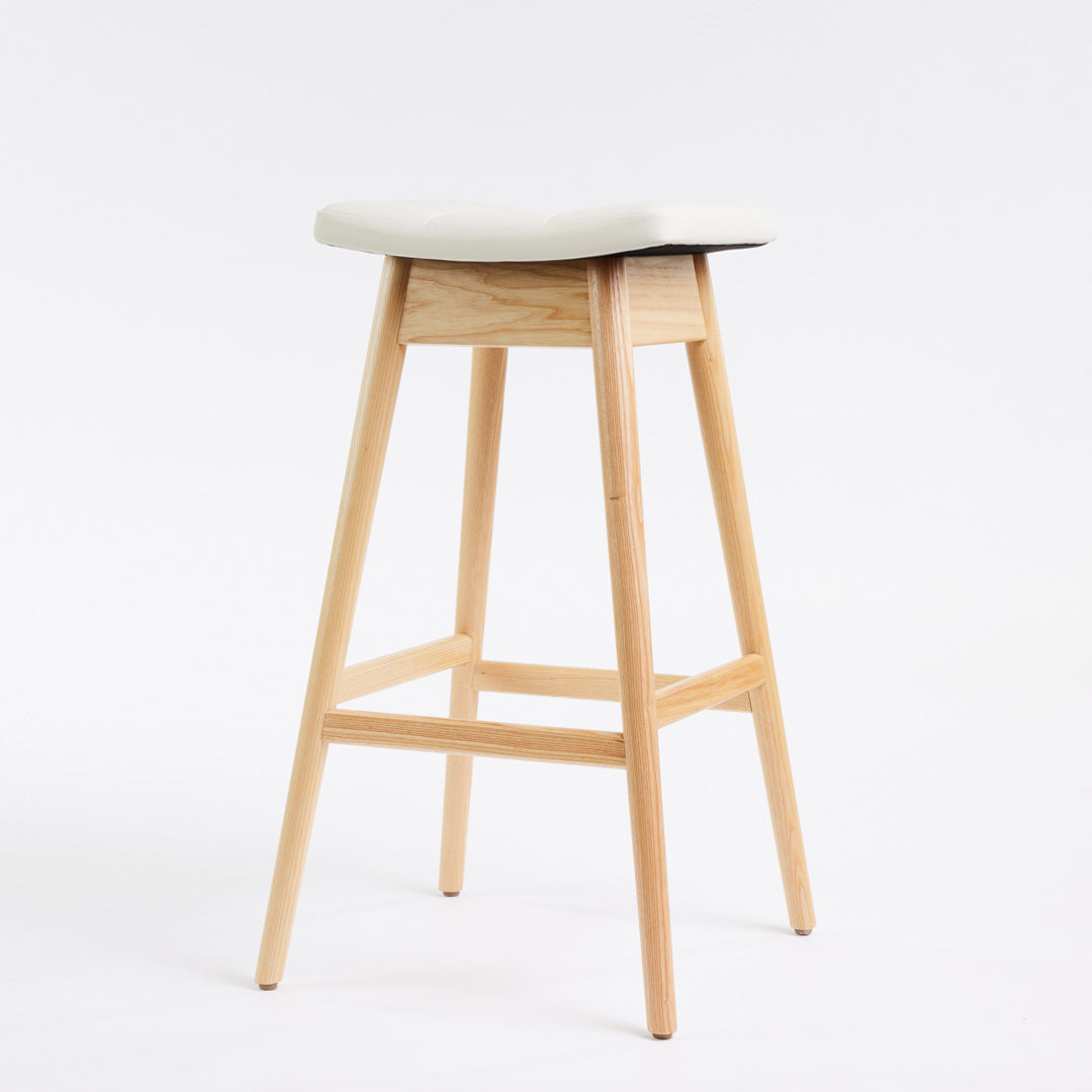 TH Brown Martelle Bar Stool in Arctic White with Clear Ash frame, blending crisp upholstery and natural timber for fresh modern Australian living.