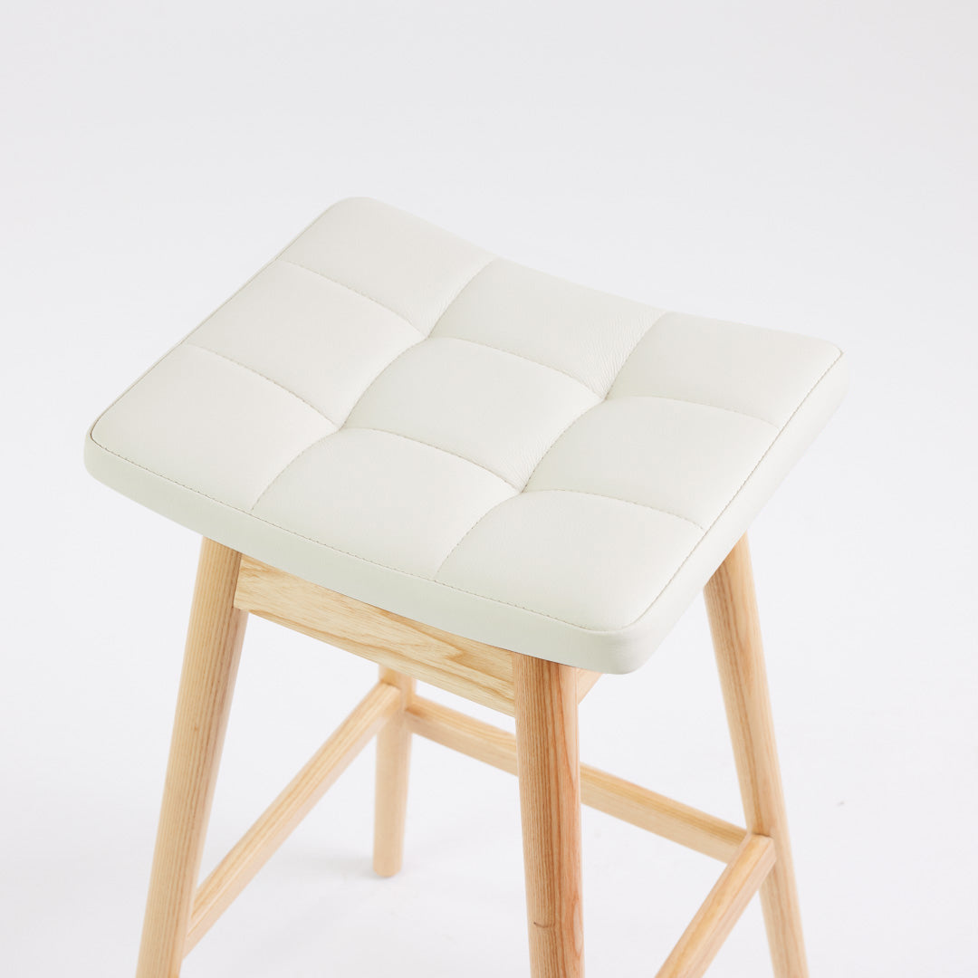 TH Brown Martelle Bar Stool in Arctic White with Clear Ash frame, blending crisp upholstery and natural timber for fresh modern Australian living.