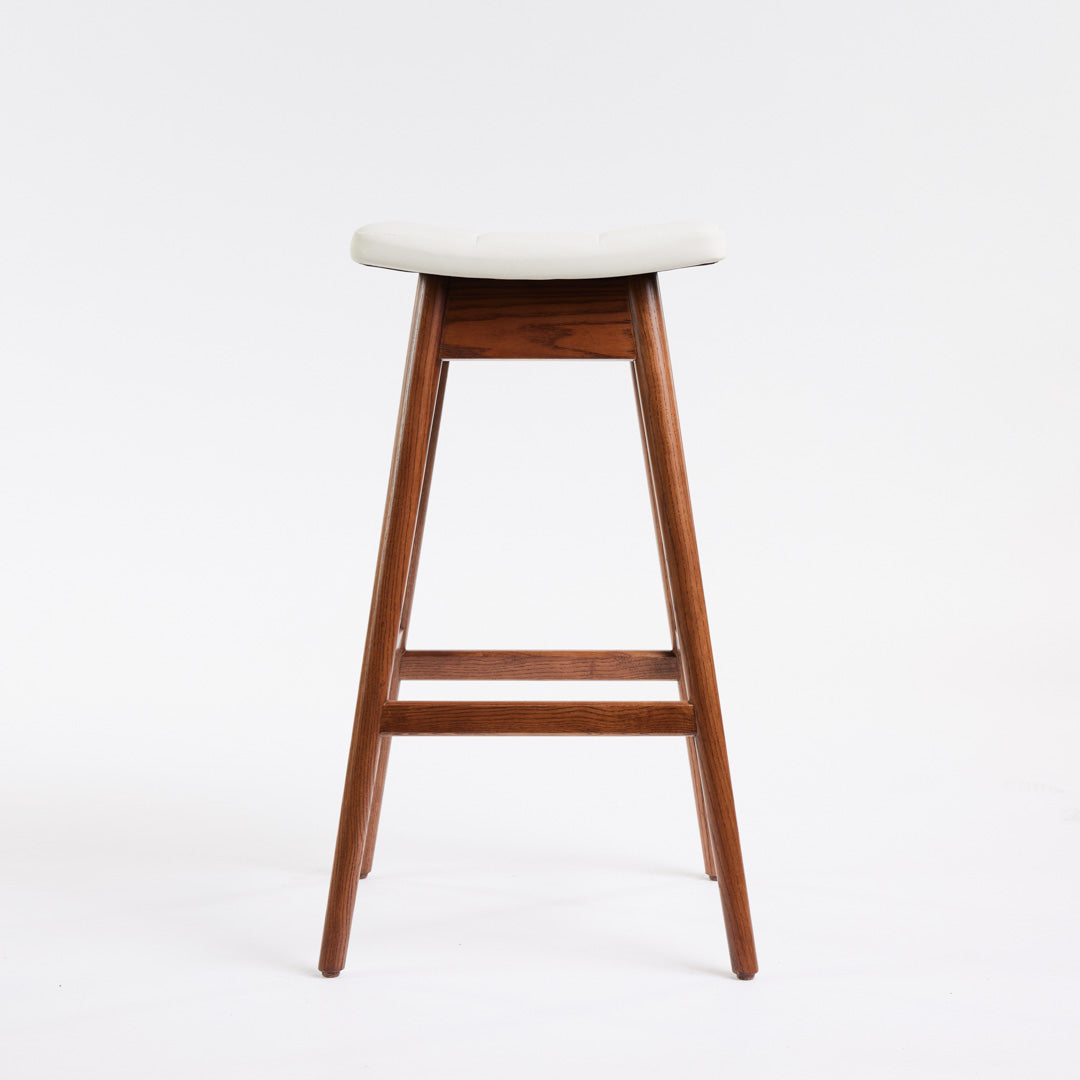 TH Brown Martelle Bar Stool in Arctic White with Dark Ash frame, blending crisp upholstery and rich timber tones for refined modern Australian living.