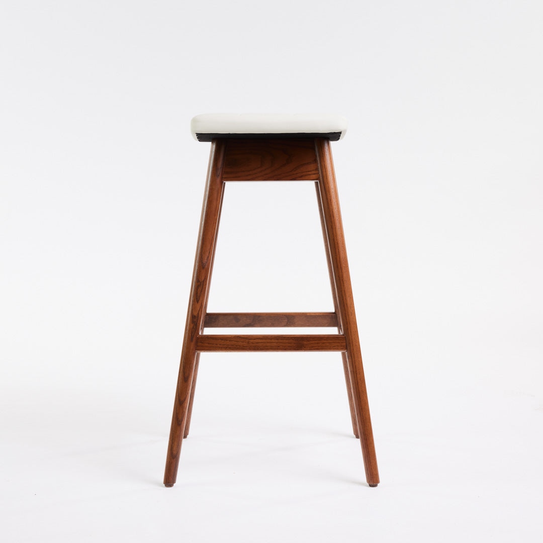 TH Brown Martelle Bar Stool in Arctic White with Dark Ash frame, blending crisp upholstery and rich timber tones for refined modern Australian living.