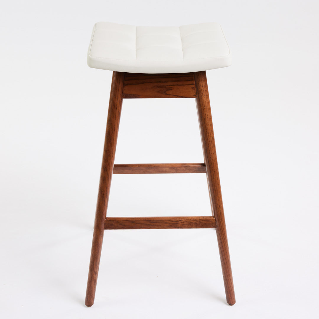 TH Brown Martelle Bar Stool in Arctic White with Dark Ash frame, blending crisp upholstery and rich timber tones for refined modern Australian living.
