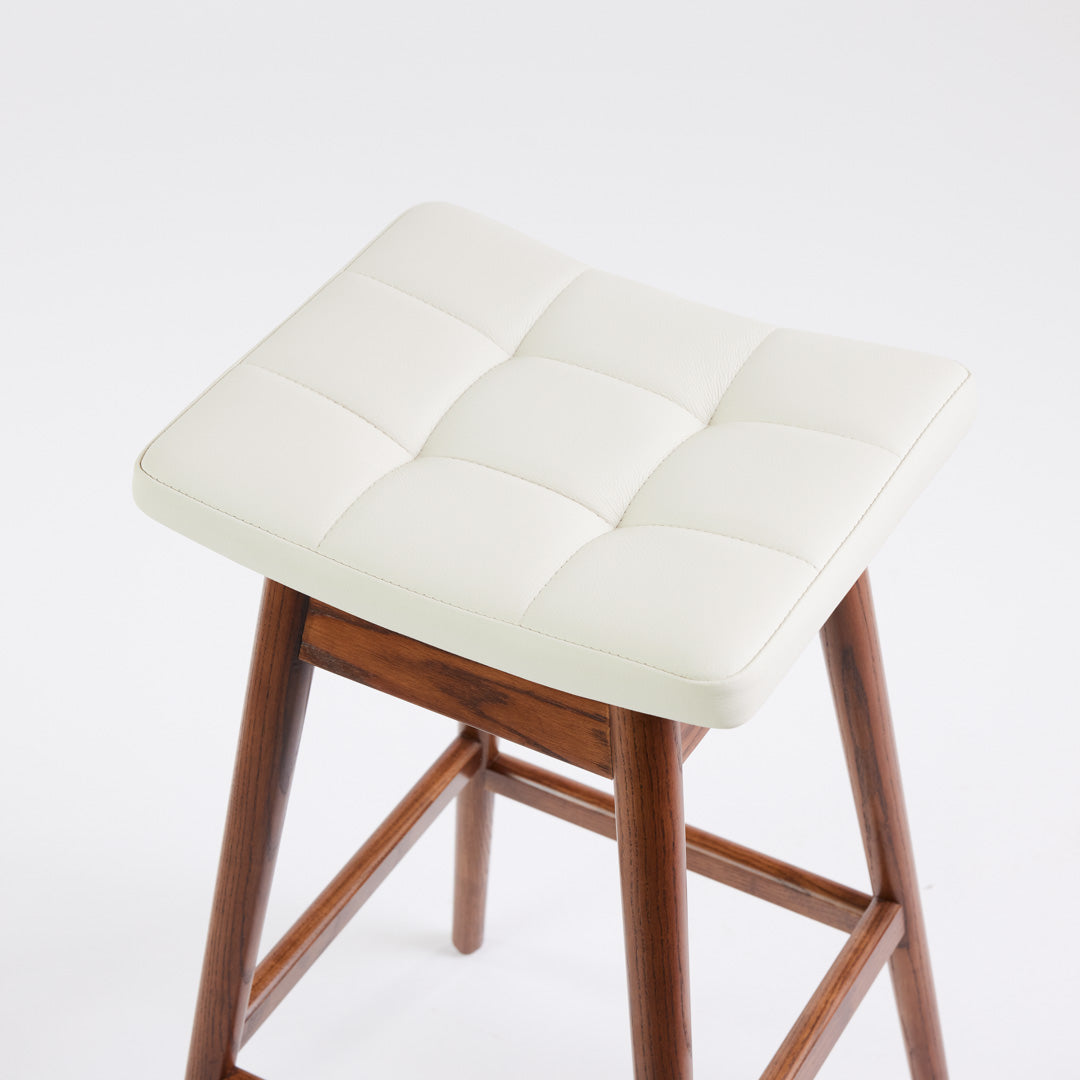 TH Brown Martelle Bar Stool in Arctic White with Dark Ash frame, blending crisp upholstery and rich timber tones for refined modern Australian living.