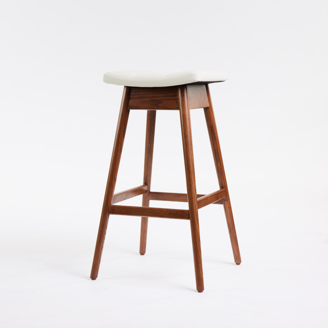 TH Brown Martelle Bar Stool in Arctic White with Dark Ash frame, blending crisp upholstery and rich timber tones for refined modern Australian living.