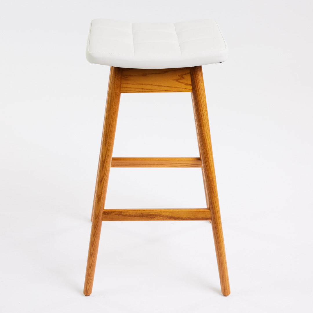 TH Brown Martelle Bar Stool in Arctic White with Light Ash frame, blending crisp upholstery and pale timber for fresh modern Australian living.