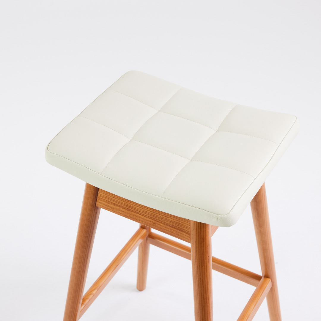 TH Brown Martelle Bar Stool in Arctic White with Teak Ash frame, blending crisp upholstery and warm timber for refined modern Australian living.