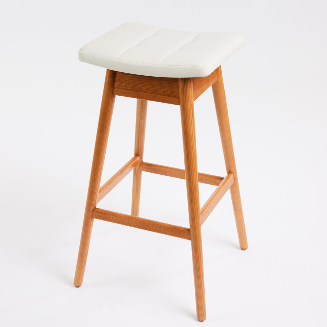 TH Brown Martelle Bar Stool in Arctic White with Teak Ash frame, blending crisp upholstery and warm timber for refined modern Australian living.