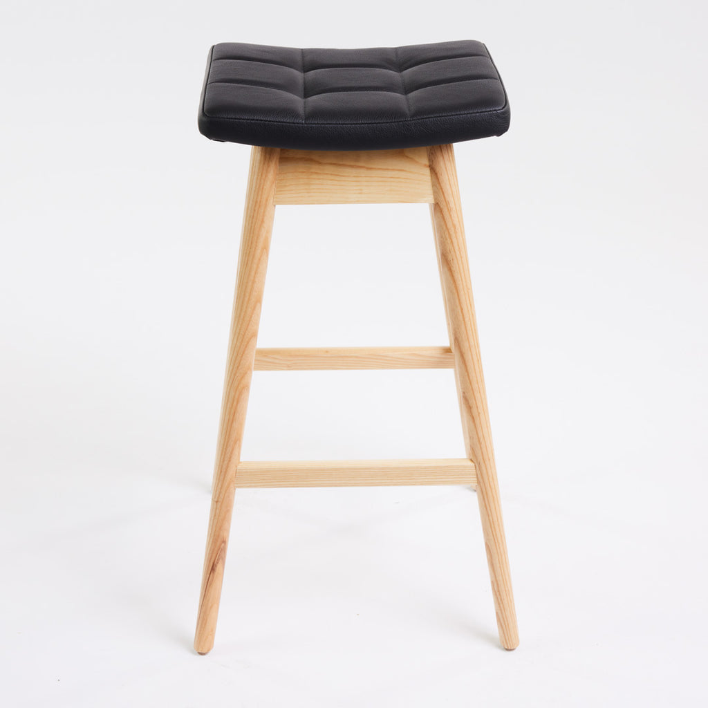 TH Brown Martelle Bar Stool in Black with Clear Ash frame, blending bold upholstery and natural timber for refined modern Australian living.