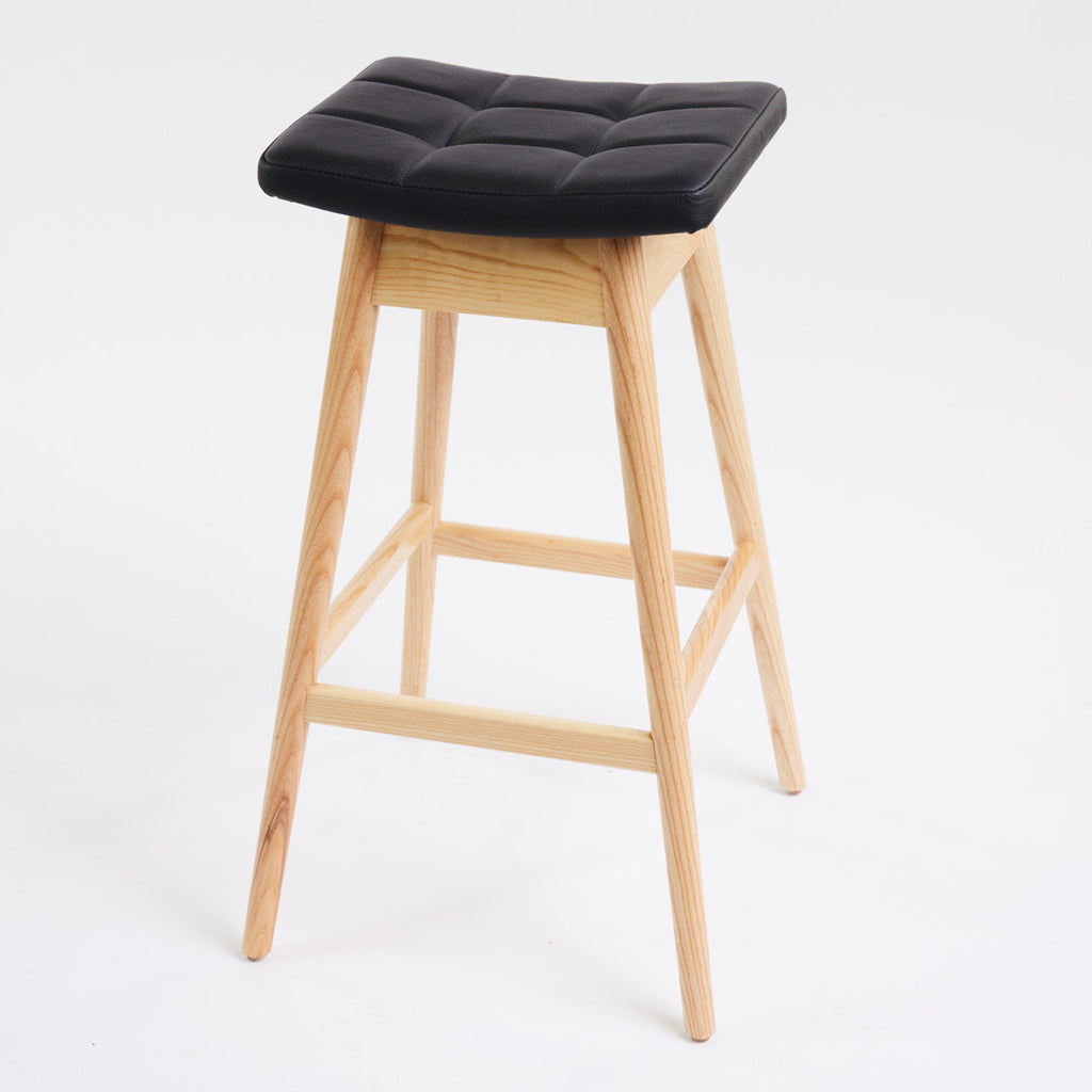 TH Brown Martelle Bar Stool in Black with Clear Ash frame, blending bold upholstery and natural timber for refined modern Australian living.
