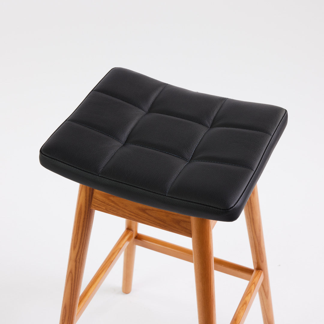 TH Brown Martelle Bar Stool in Black with Teak Ash frame, blending bold upholstery and warm timber for sophisticated modern Australian living.