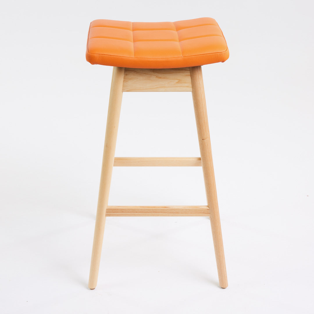 TH Brown Martelle Bar Stool in Calypso Orange with Clear Ash frame, blending vibrant colour and natural timber for playful modern Australian living.
