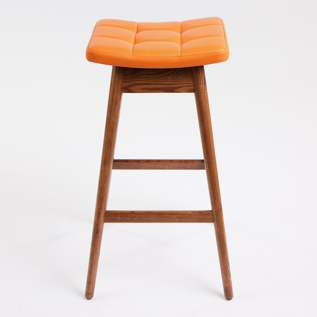 TH Brown Martelle Bar Stool in Calypso Orange with Dark Ash frame, blending vibrant colour and rich timber tones for bold modern Australian living.