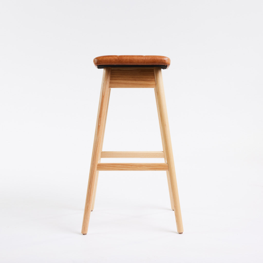 TH Brown Martelle Bar Stool in Oak Brown with Clear Ash frame, blending warm earthy upholstery and natural timber for relaxed modern Australian living.