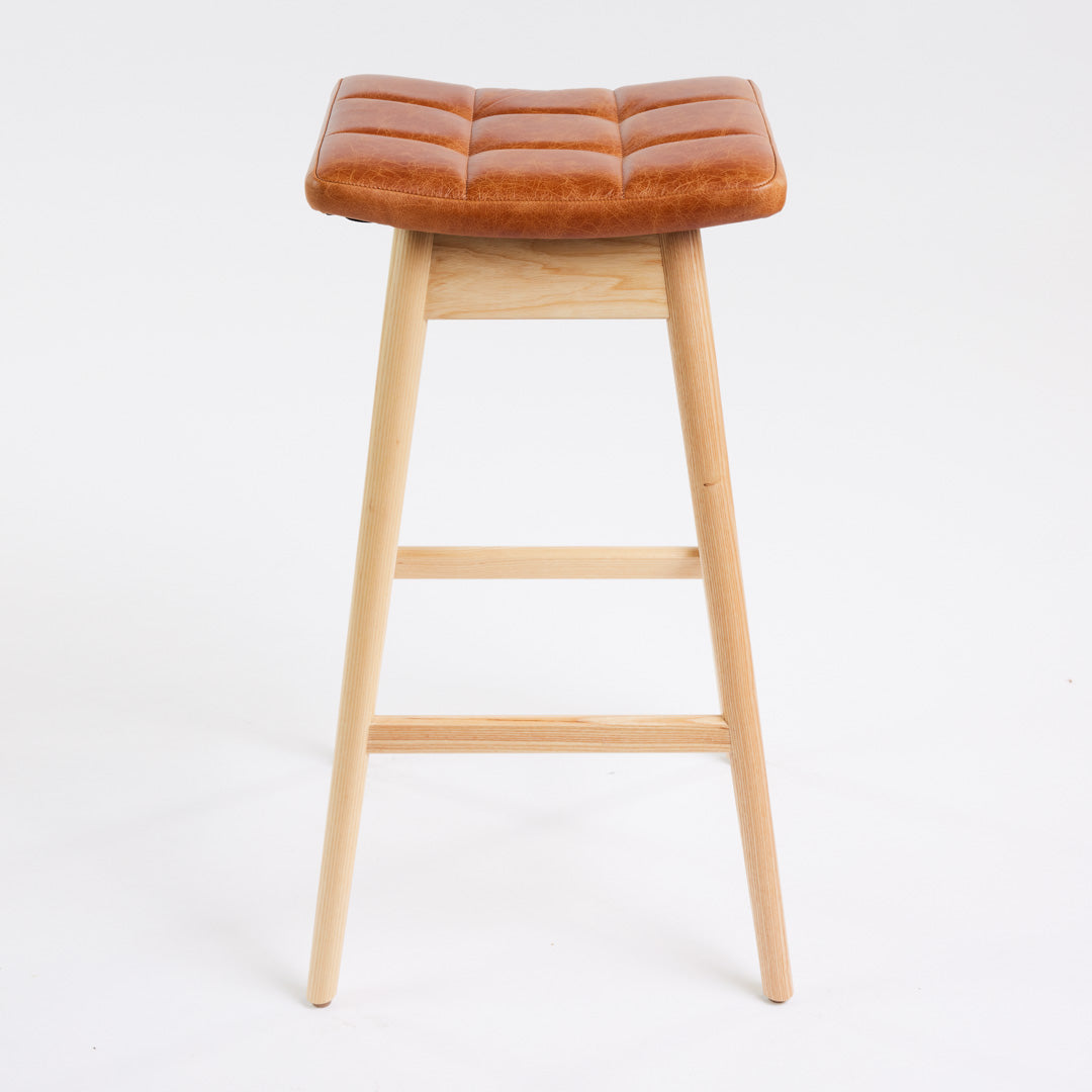 TH Brown Martelle Bar Stool in Oak Brown with Clear Ash frame, blending warm earthy upholstery and natural timber for relaxed modern Australian living.