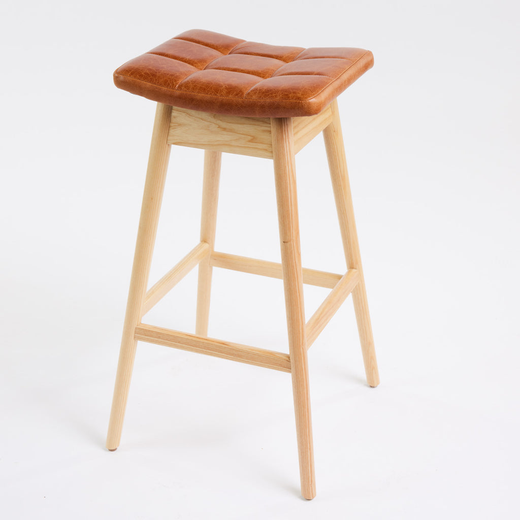 TH Brown Martelle Bar Stool in Oak Brown with Clear Ash frame, blending warm earthy upholstery and natural timber for relaxed modern Australian living.