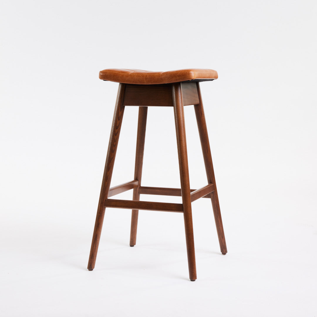 TH Brown Martelle Bar Stool in Oak Brown with Dark Ash frame, blending warm earthy upholstery and rich timber tones for sophisticated modern Australian living.