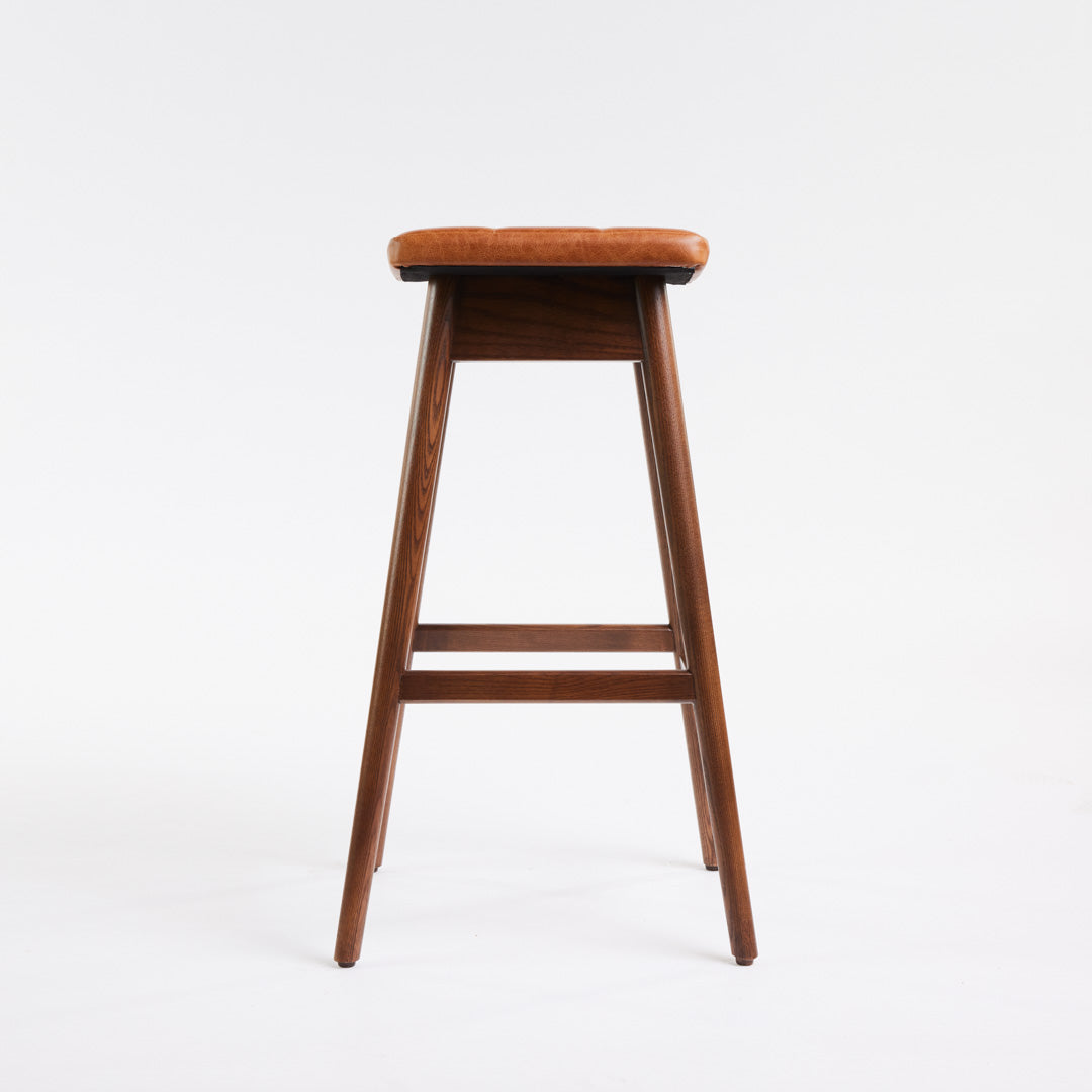TH Brown Martelle Bar Stool in Oak Brown with Dark Ash frame, blending warm earthy upholstery and rich timber tones for sophisticated modern Australian living.