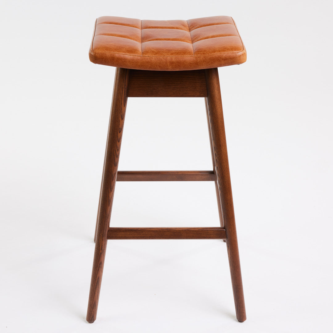 TH Brown Martelle Bar Stool in Oak Brown with Dark Ash frame, blending warm earthy upholstery and rich timber tones for sophisticated modern Australian living.