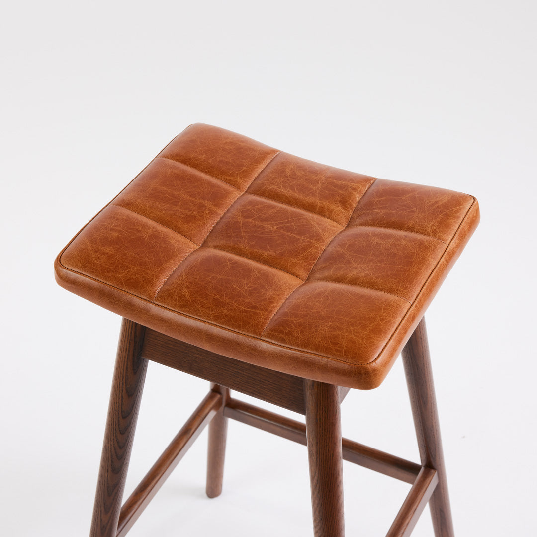 TH Brown Martelle Bar Stool in Oak Brown with Dark Ash frame, blending warm earthy upholstery and rich timber tones for sophisticated modern Australian living.