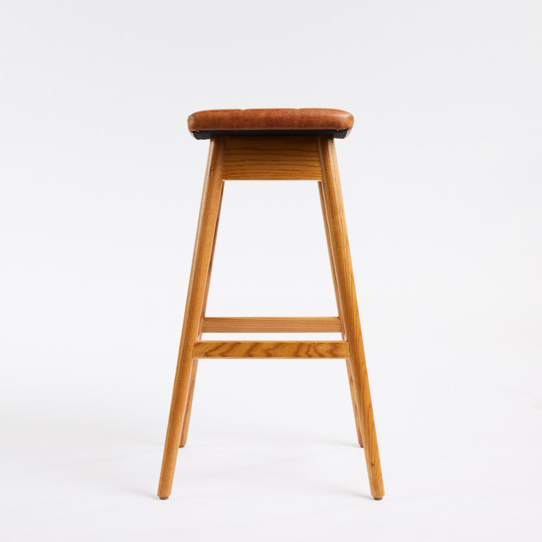 TH Brown Martelle Bar Stool in Oak Brown with Light Ash frame, blending warm earthy upholstery and pale timber for relaxed modern Australian living.