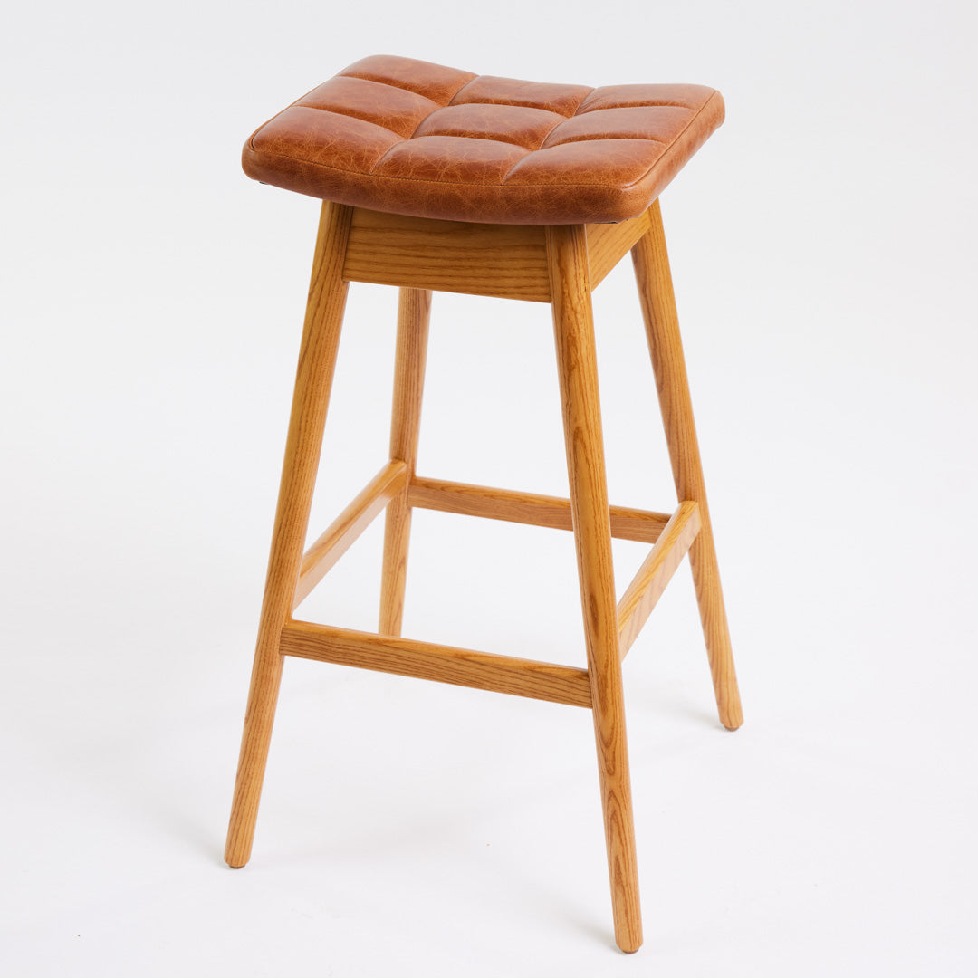 TH Brown Martelle Bar Stool in Oak Brown with Light Ash frame, blending warm earthy upholstery and pale timber for relaxed modern Australian living.