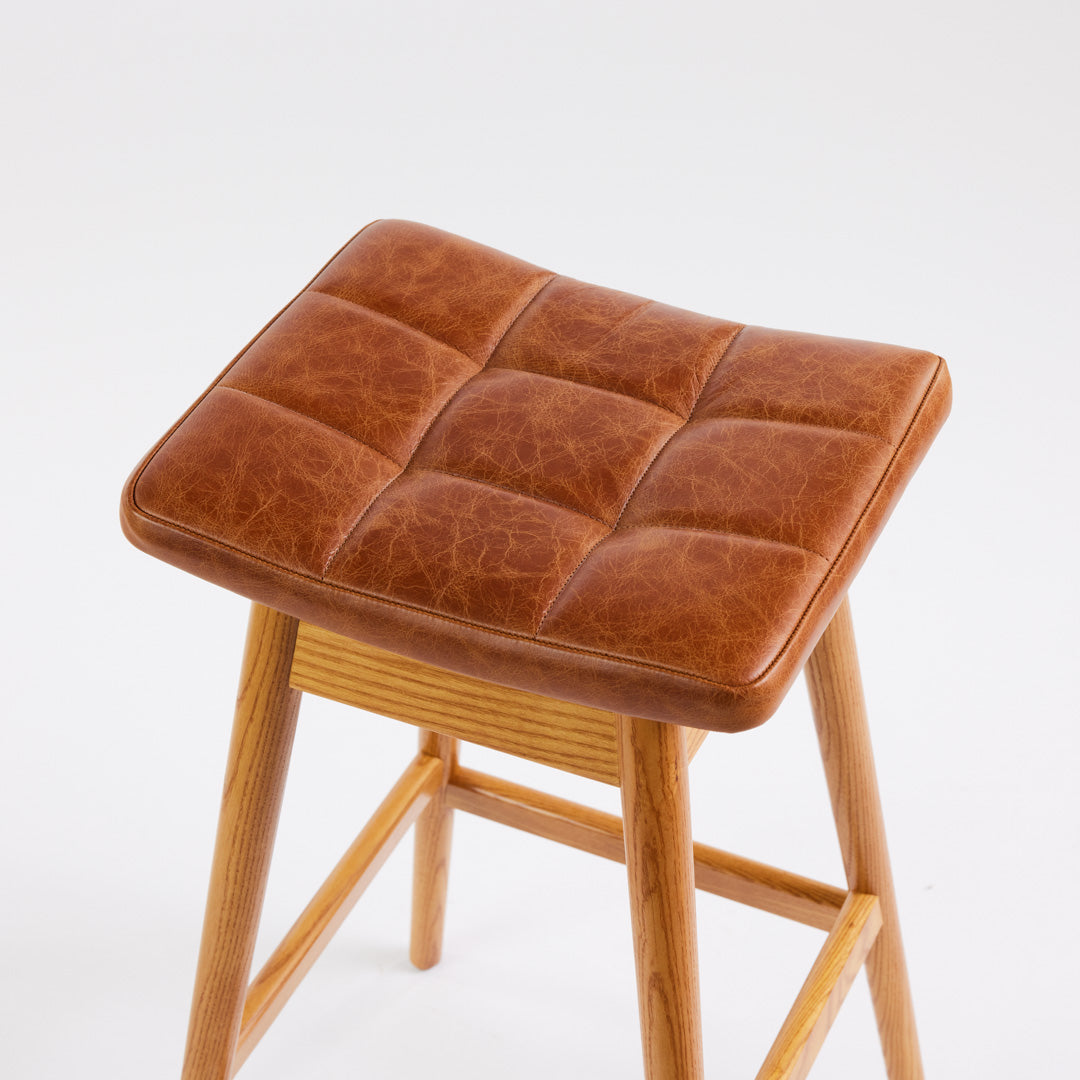 TH Brown Martelle Bar Stool in Oak Brown with Light Ash frame, blending warm earthy upholstery and pale timber for relaxed modern Australian living.