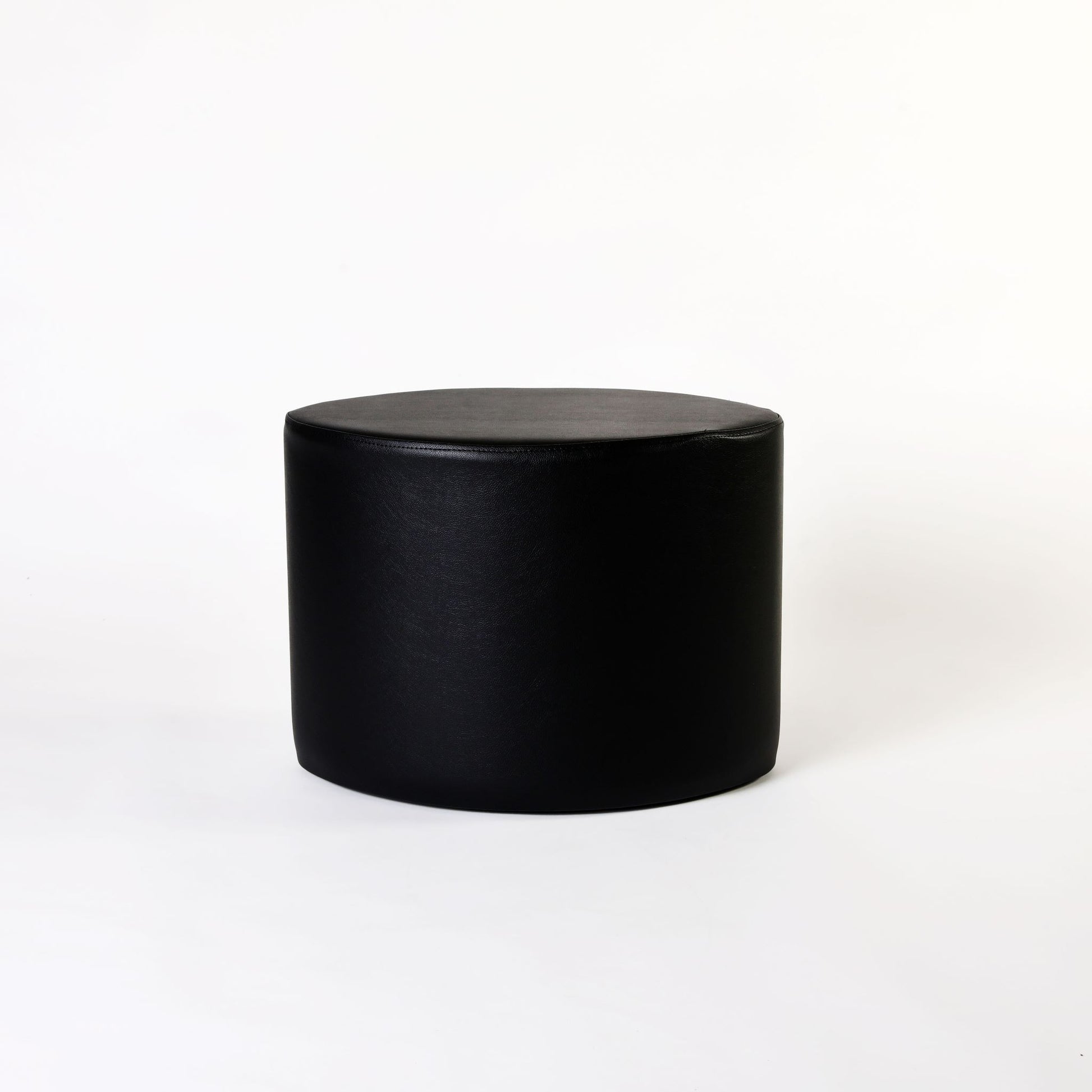 TH Brown Rondo Stool in Black, showcasing its sculptural form and bold monochrome finish for timeless modern Australian living.