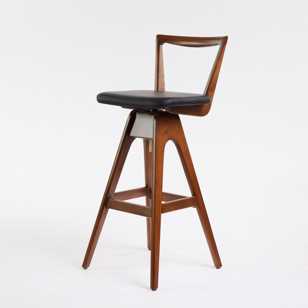 TH Brown Danish Bar Stool in Dark Ash timber with black leather seat, an Australian mid-century modern design